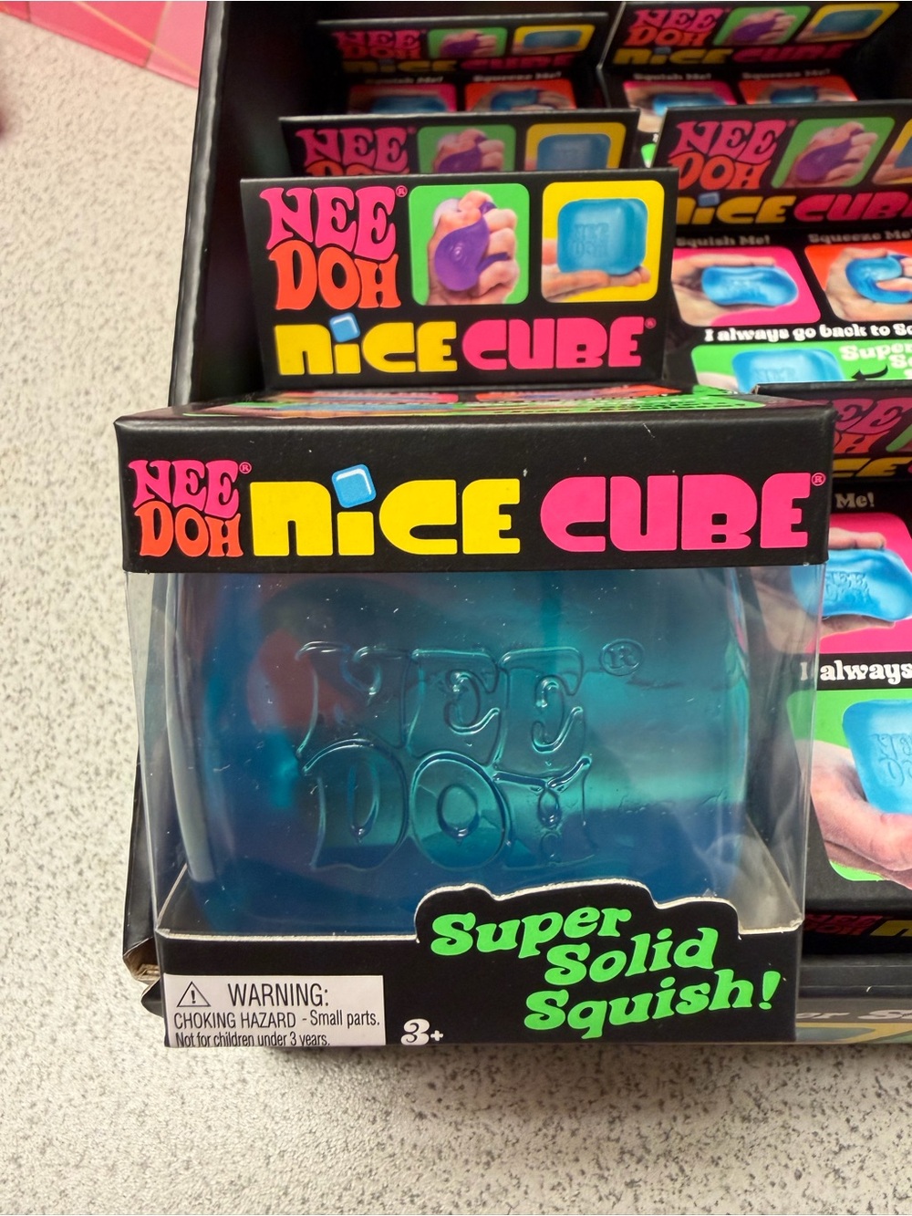 Nice Cube Kids Squishy Toy - Blue, Pink, and Purple.